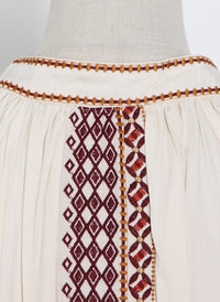 Moroccan High Neck Embroidered Tassel Swing Dress in Beige